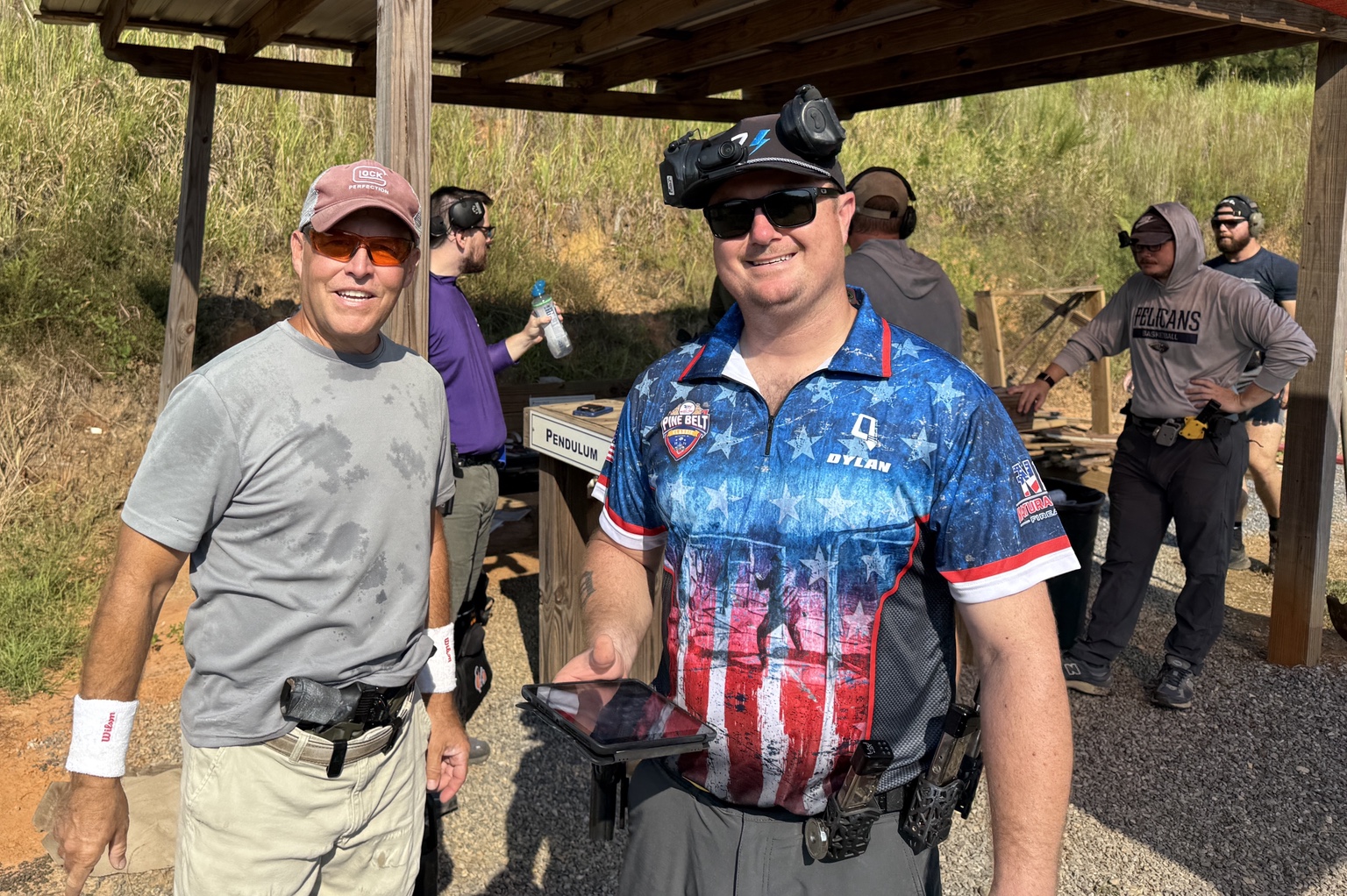 USPSA competitors at a pistol bay